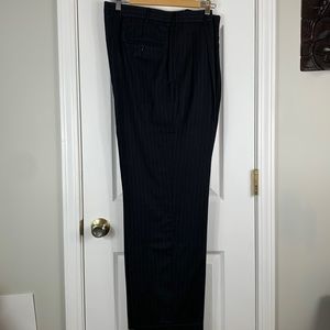 Black pleated pinstriped mens dress pants with cuff at end of leg. Waist 17.5”